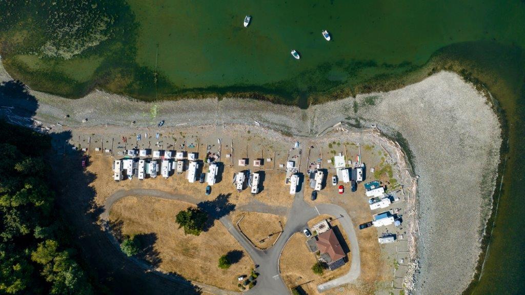 Overhead view of RV sites and beach at Beachcomber RV Park
