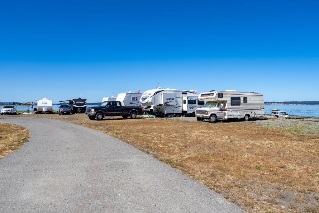 Waterfront RV sites and access road at Beachcomber RV Park