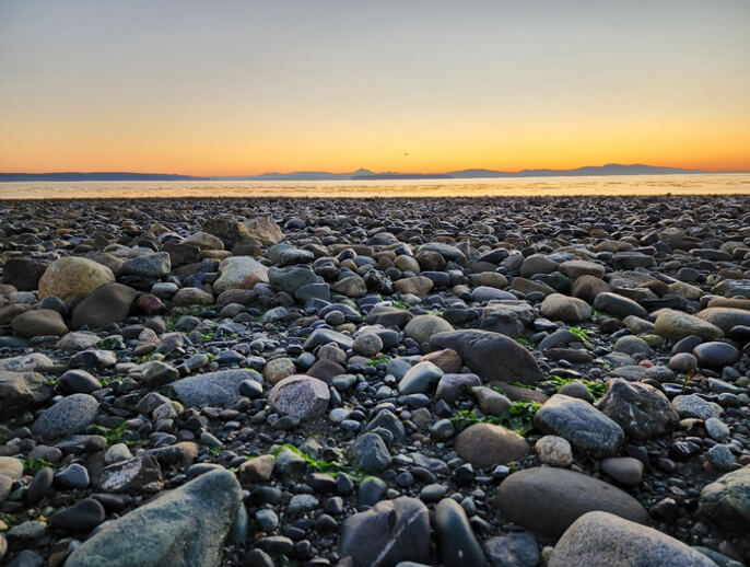 Rocky shoreline at sunset near Beachcomber RV Park